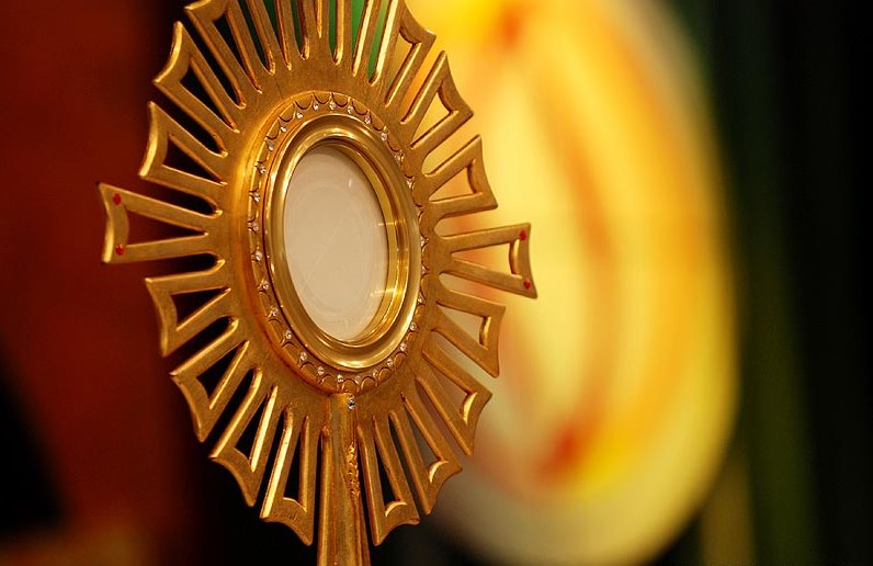 Qual a origem de  Corpus Christi?